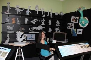 Blue Sky Studios animator Alena Wooten hangs out in a simulation of her digital sculpting workspace, as seen in the exhibition "'Ice Age' to the Digital Age." (Photo ©Norman Rockwell Museum. All rights reserved.)