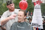 Matthew Ketchum gives a MorganChase 'banker' a haircut at Zuccotti Park