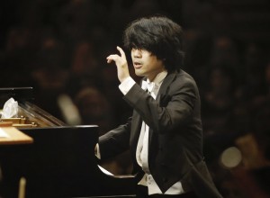 Sean Chen, 24, of United States, performs with the Fort Worth Symphony Orchestra conducted by Leonard Slatkin, left, in the final rounds of the 14th Van Cliburn International Piano Competition at Bass Hall in Fort Worth, Texas, USA on Sunday, June 9, 2013. (Photo by Carolyn Cruz/ The Cliburn)